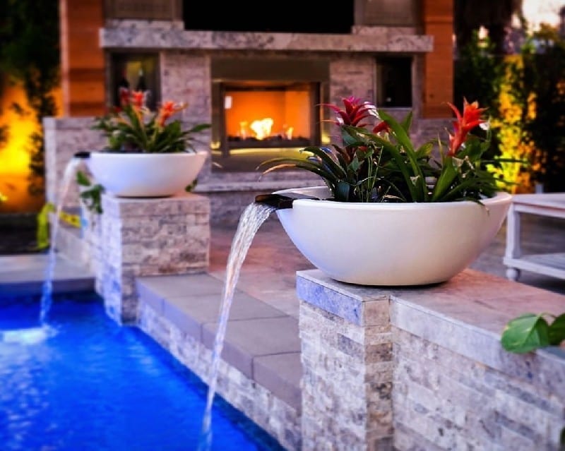 The Outdoor Plus Sedona GFRC Planter and Water Bowl With Plant and Water in Pool Area