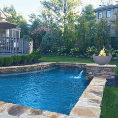 The Outdoor Plus Luna GFRC Fire Bowl in the Pool Area 