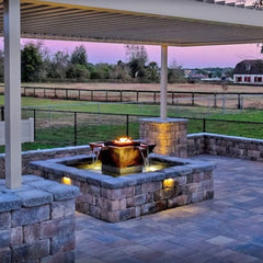 The Outdoor Plus 60-inch Olympian Square 4-way Spill Fire and Water Fountain in the backyard view