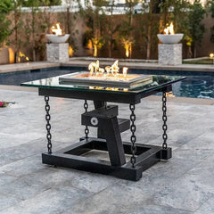 The Outdoor Plus Newton Powder Coated with Chain Support Fire Pit with Yellow Flames in Pool Area