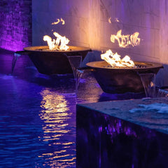 The Outdoor Plus Cazo Fire and Water Bowl Hammered Copper Finish in the Pool Area Night View
