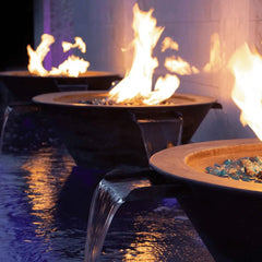 The Outdoor Plus Cazo Fire and Water Bowl Hammered Copper Finish in the Side of the Pool Area