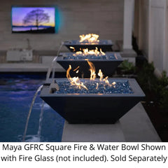 The Outdoor Plus Maya Square Fire and Water Bowl with Fire Glass in the Side of Pool