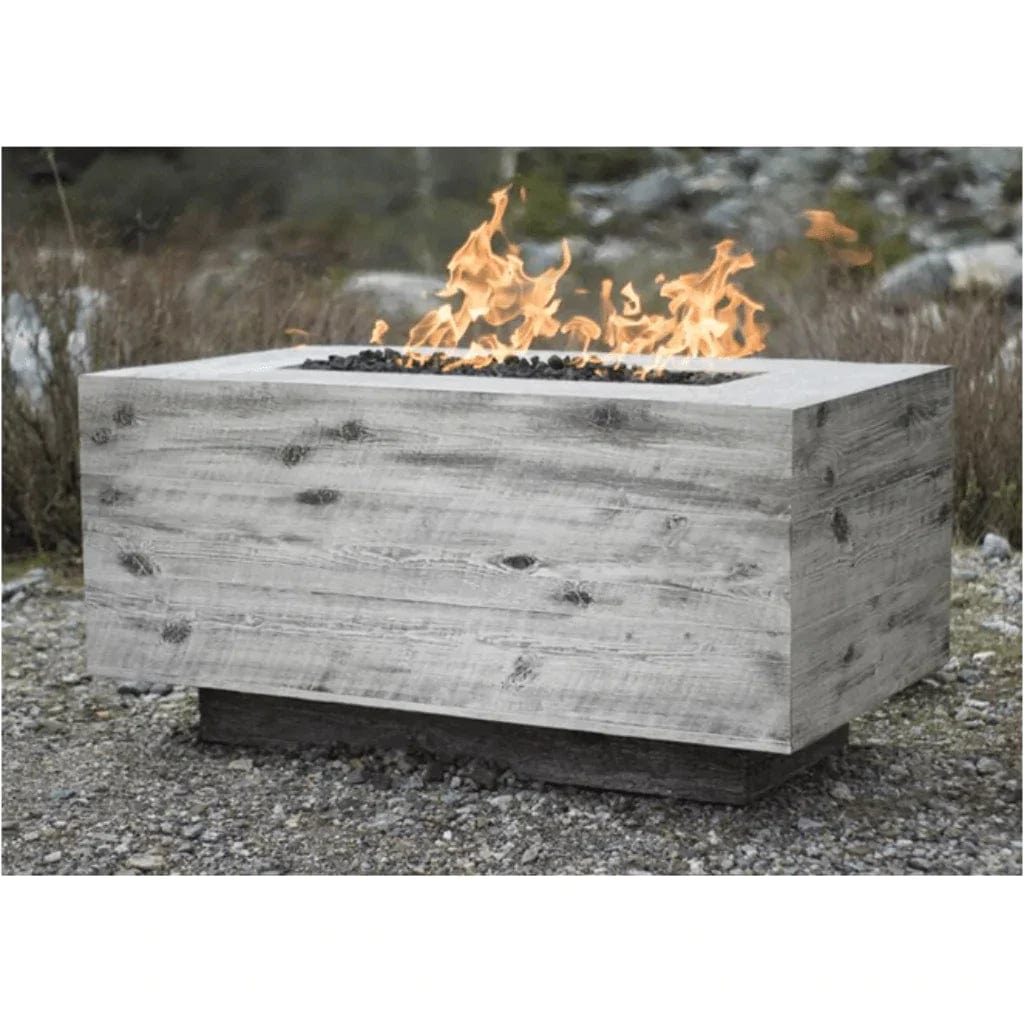 The Outdoor Plus Catalina Fire Pit Table  with Grass Behind