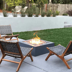 The Outdoor Plus Quad Concrete Fire Pit with Yellow Flames in Outdoor View