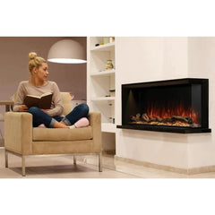Modern Flames Built In Electric Fireplace with White Wall and Women on Chair