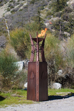 The Outdoor Plus 87-inch Bastille Fire Tower Outside View with some tree in the Background